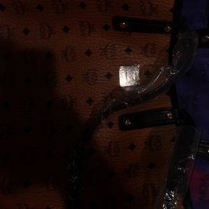 Selling a MCM LARGE BAG and mini Clutch with it